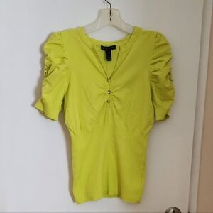 NWOT. INC. Lady's Top with Ruffles Sleeves Pattern and Three Shiny Buttons.